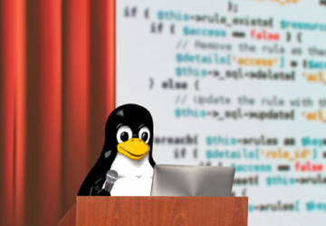 Tux mentre presenta un talk